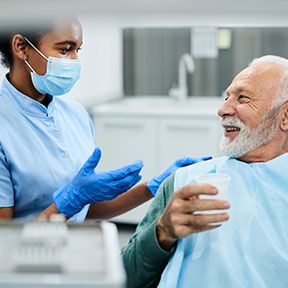 patient visiting dentist after getting dental implants in Lake Nona