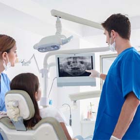 dentist in Lake Nona showing patient an X-ray