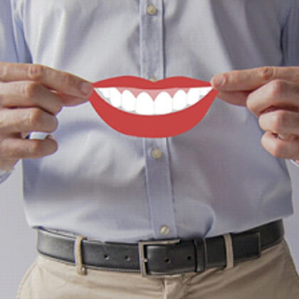 dentist holding digital mouth