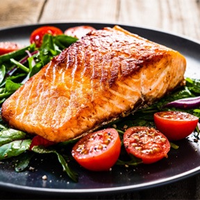 Healthy meal of fish and leafy greens