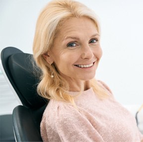 Woman smiling in the dental chair