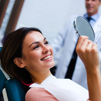 a patient visiting her dentist to receive a dental crown in Lake Nona, FL