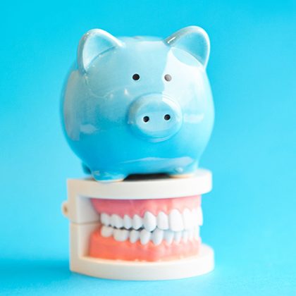 piggy bank and dentures