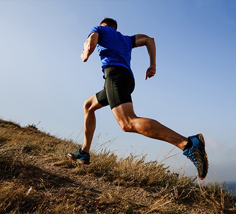 Person running on a trail