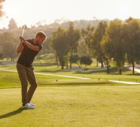 Person golfing