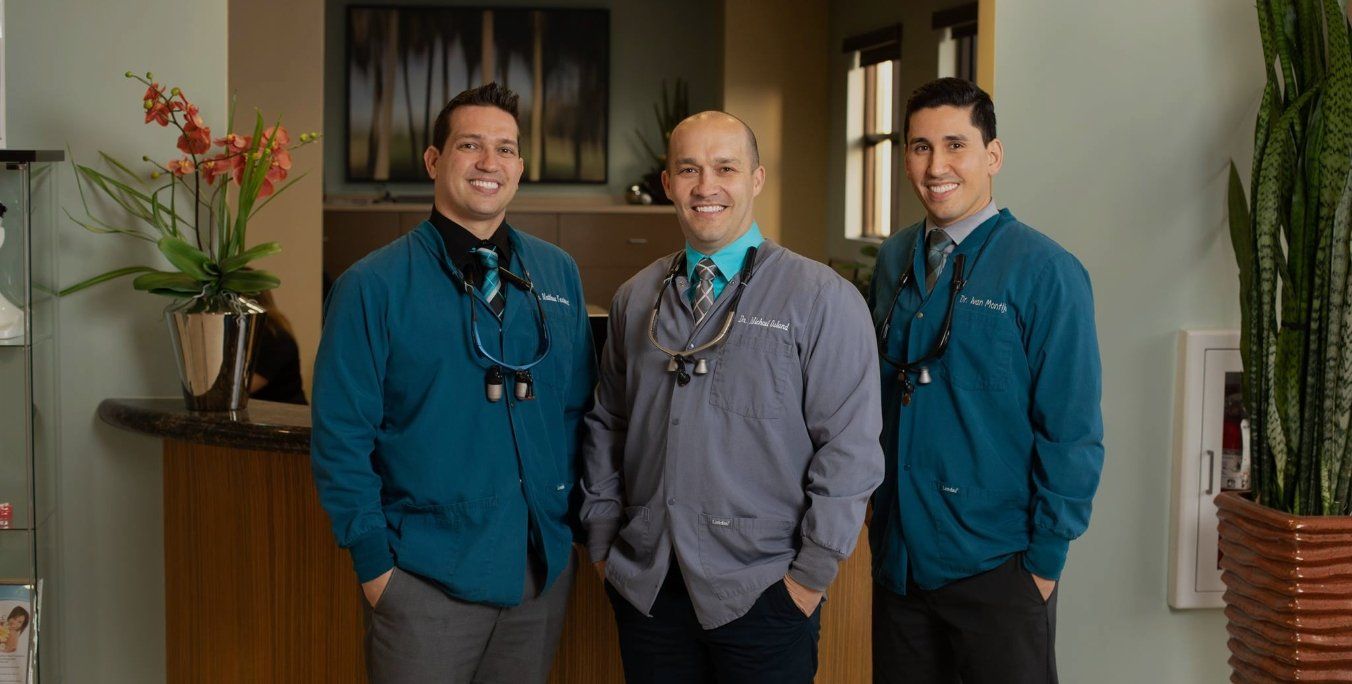 Three Lake Nona Region dentists smiling in dental office