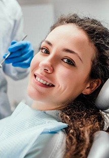 Woman smiling during preventive dentistry visit