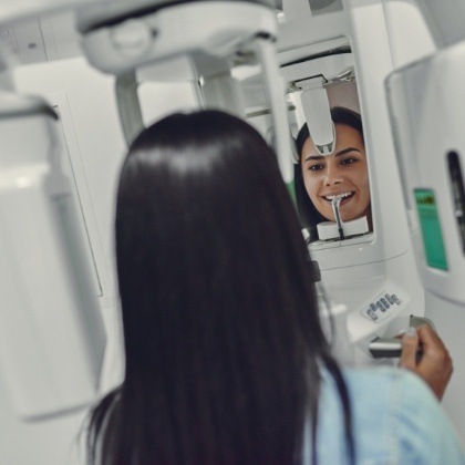 Woman receiving 3 D cone beam imaging scans