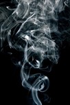 Cigarette smoke against a black background.